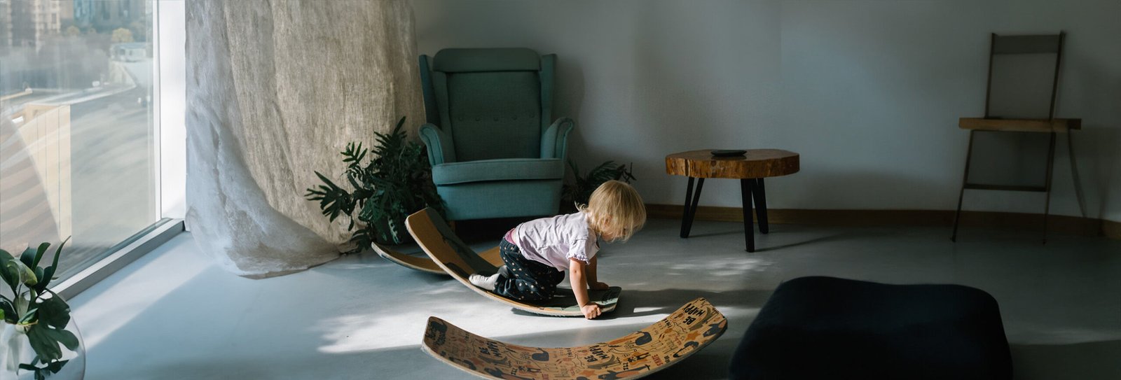 Kids montessori rocker balance board in a flat living room