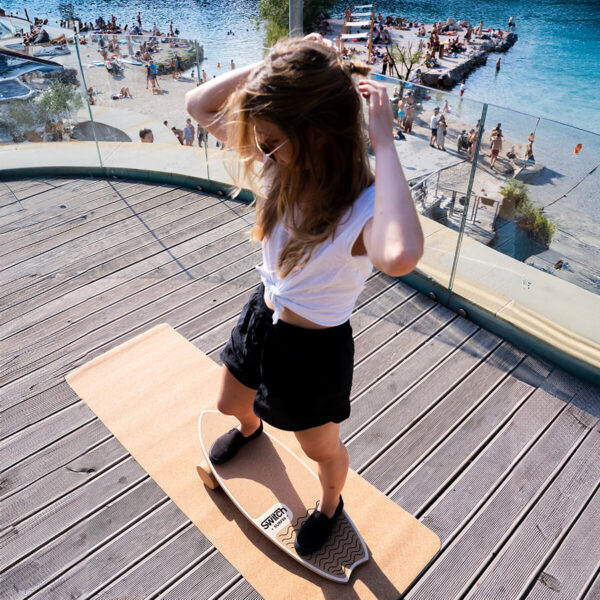Girl training on surf Balance Board