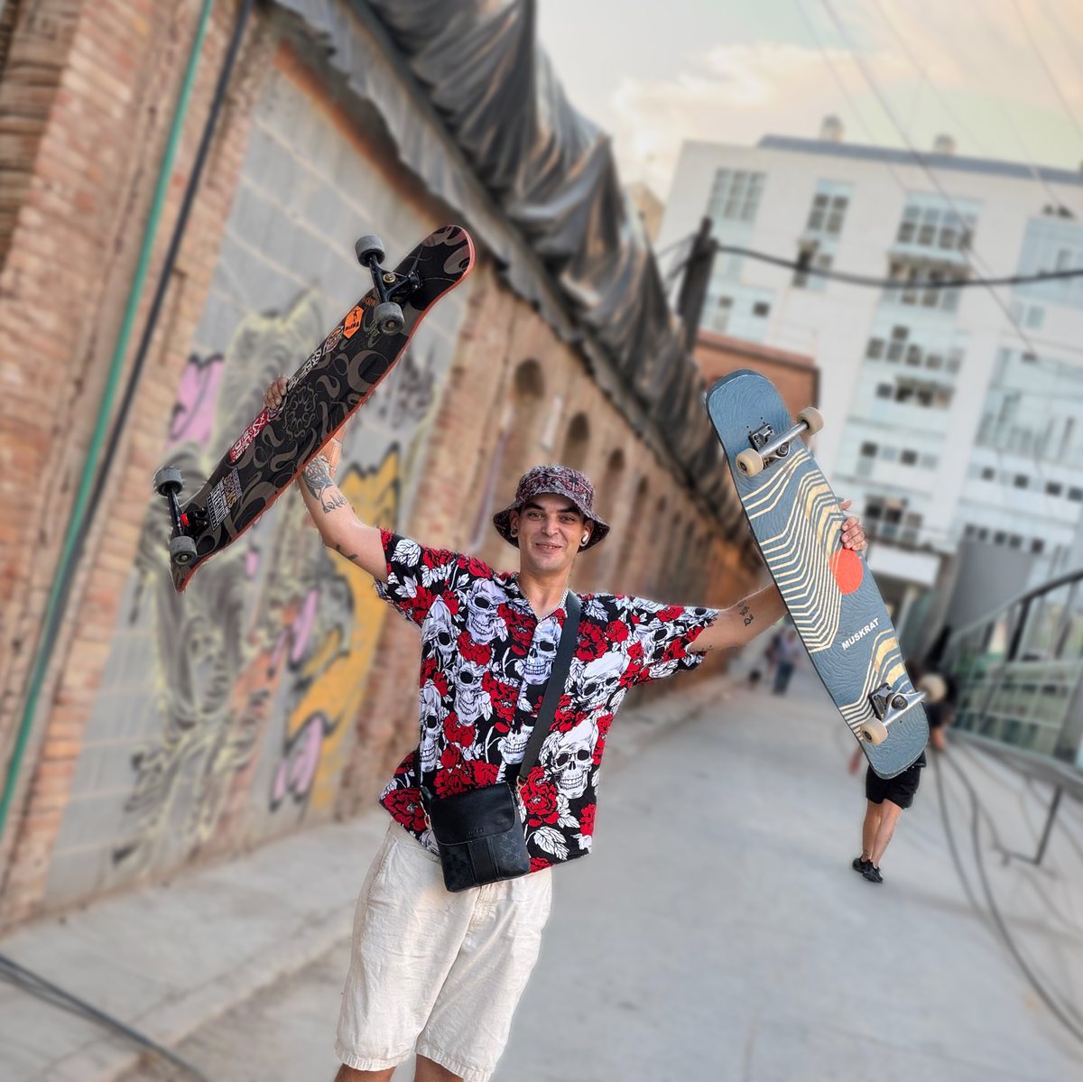 Roc holding two longboards — SWITCH team rider
